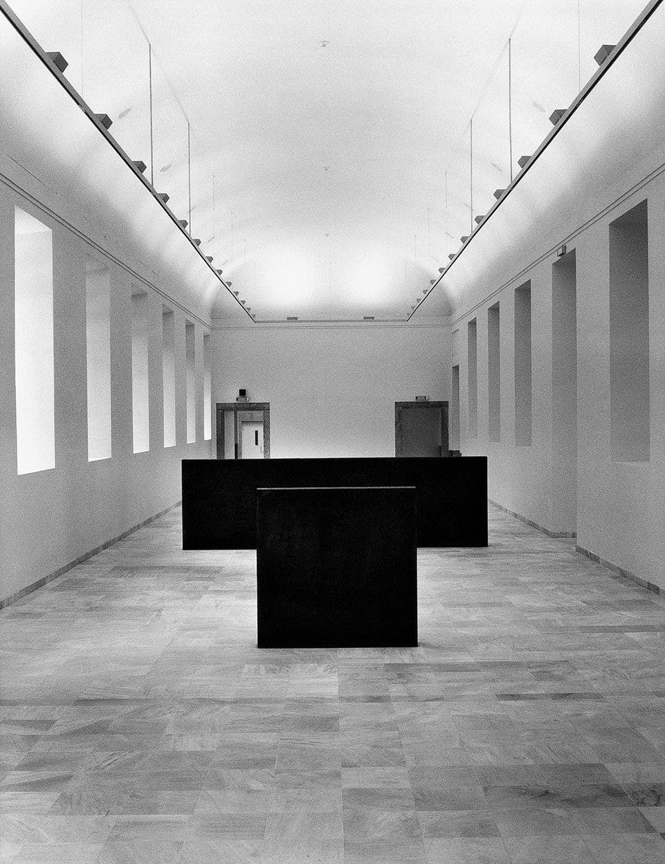 A sculpture by Richard Serra made of four slabs of steel, titled Equal-Parallel: Guernica-Bengasi, dated 1986.
